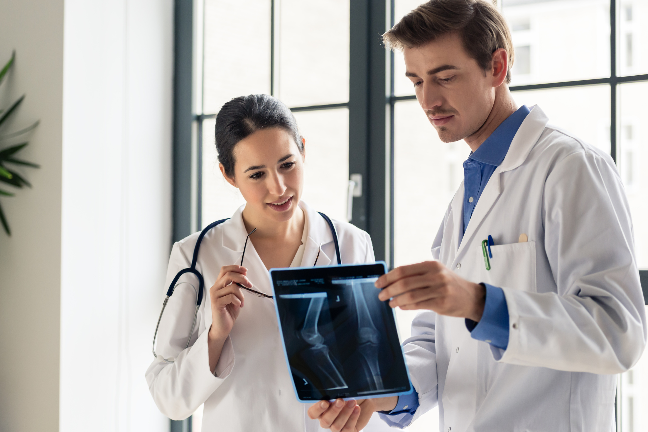 Doctors Analyzing the Radiograph of a Patient